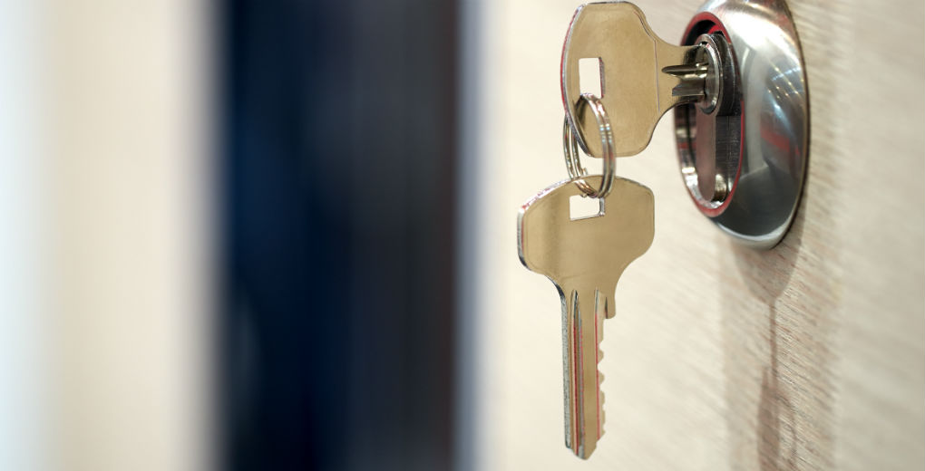 House keys in door - Hine Chartered Insurance Brokers